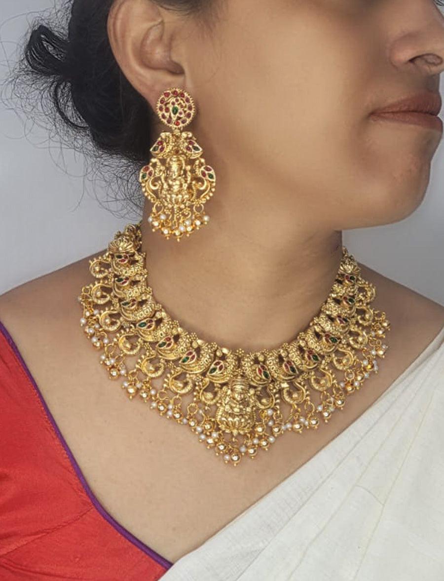 Radiance of Tradition: Exquisite Gold Necklace and Earrings Set